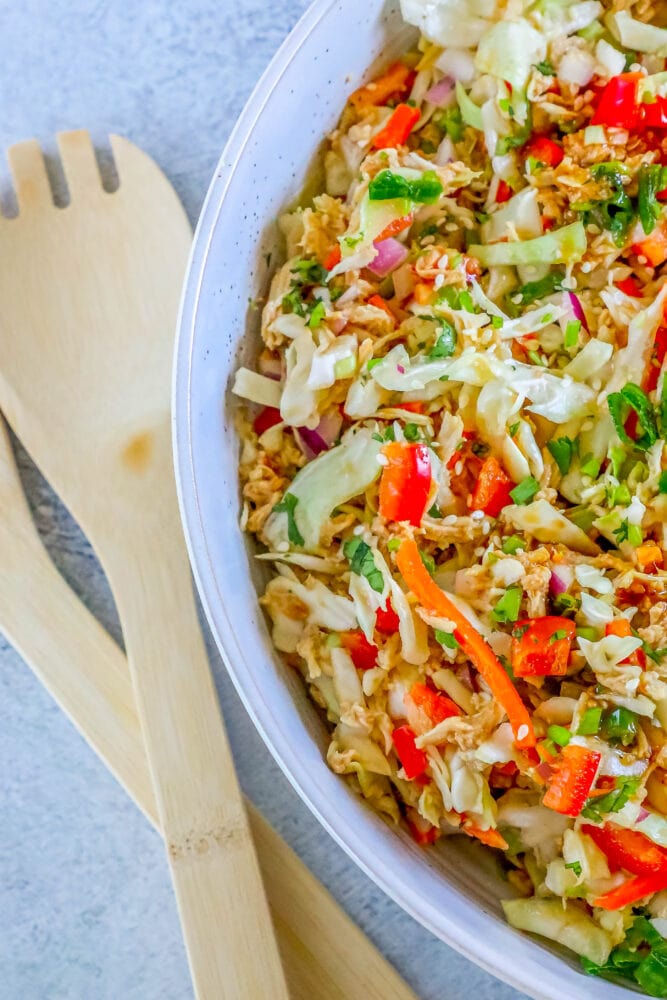 picture of Thai chicken salad in a white bowl on a table 