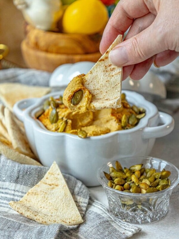 picture of pumpkin hummus in a glass pumpkin bowl