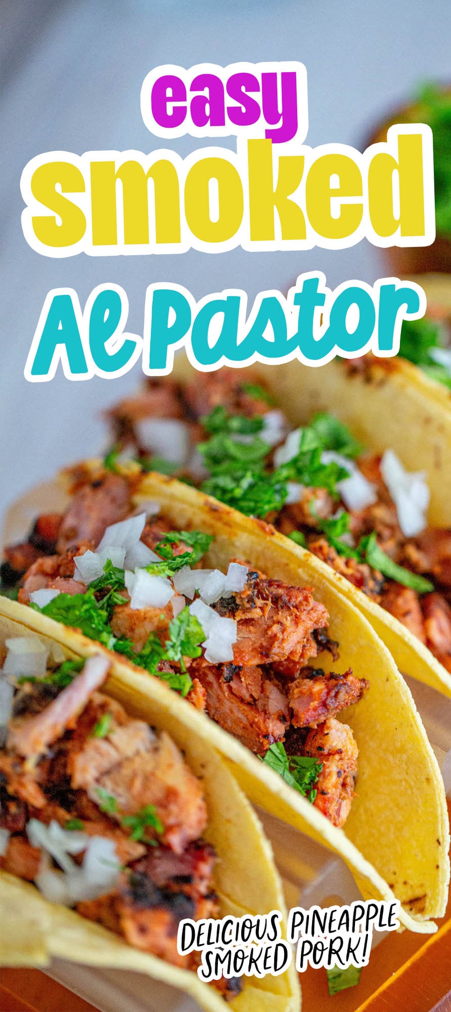 picture of chopped smoked al pastor in a taco topped with chopped cilantro and white onion