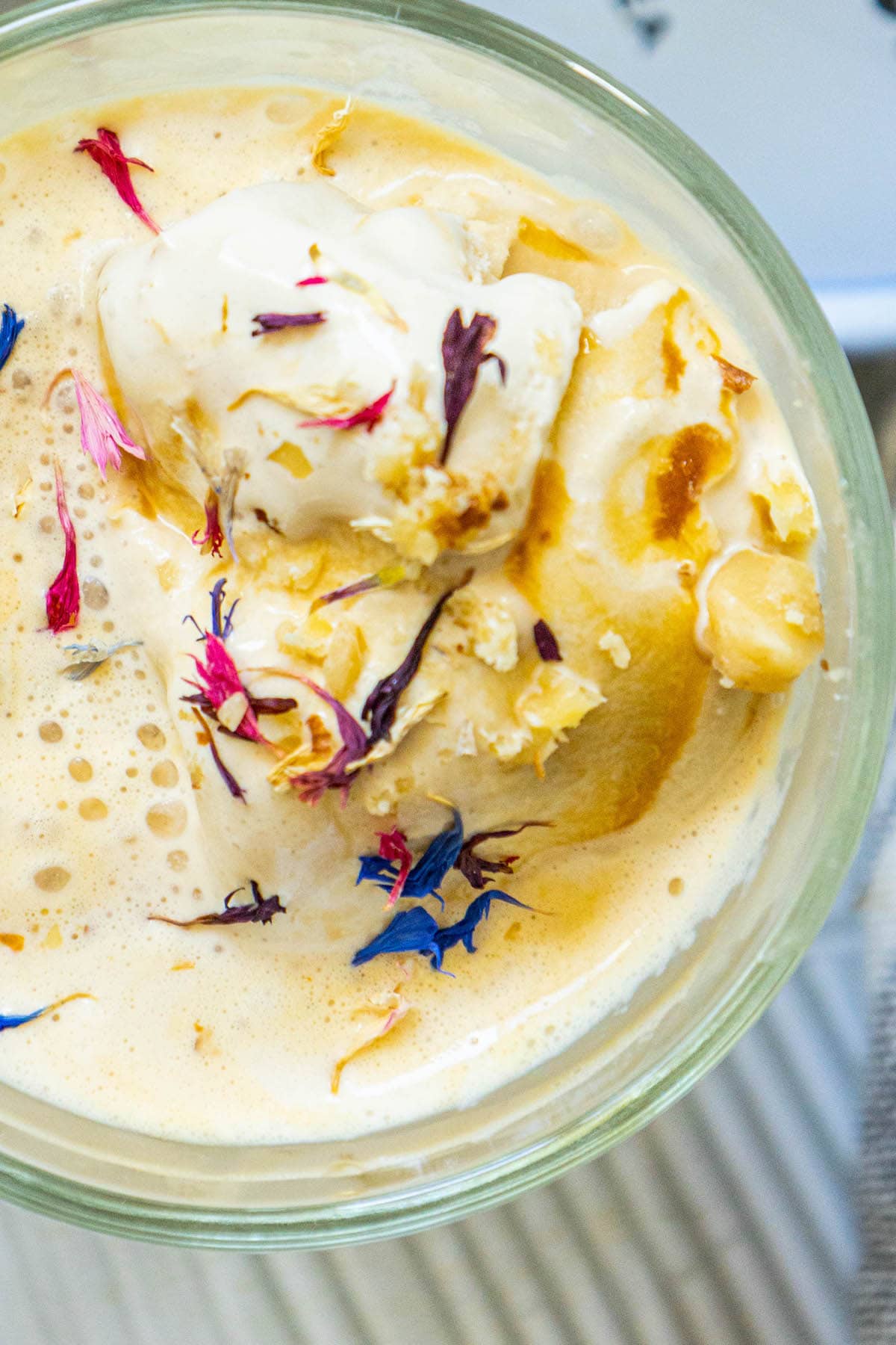 picture of earl grey affogato in a glass mug with corn flowers on top