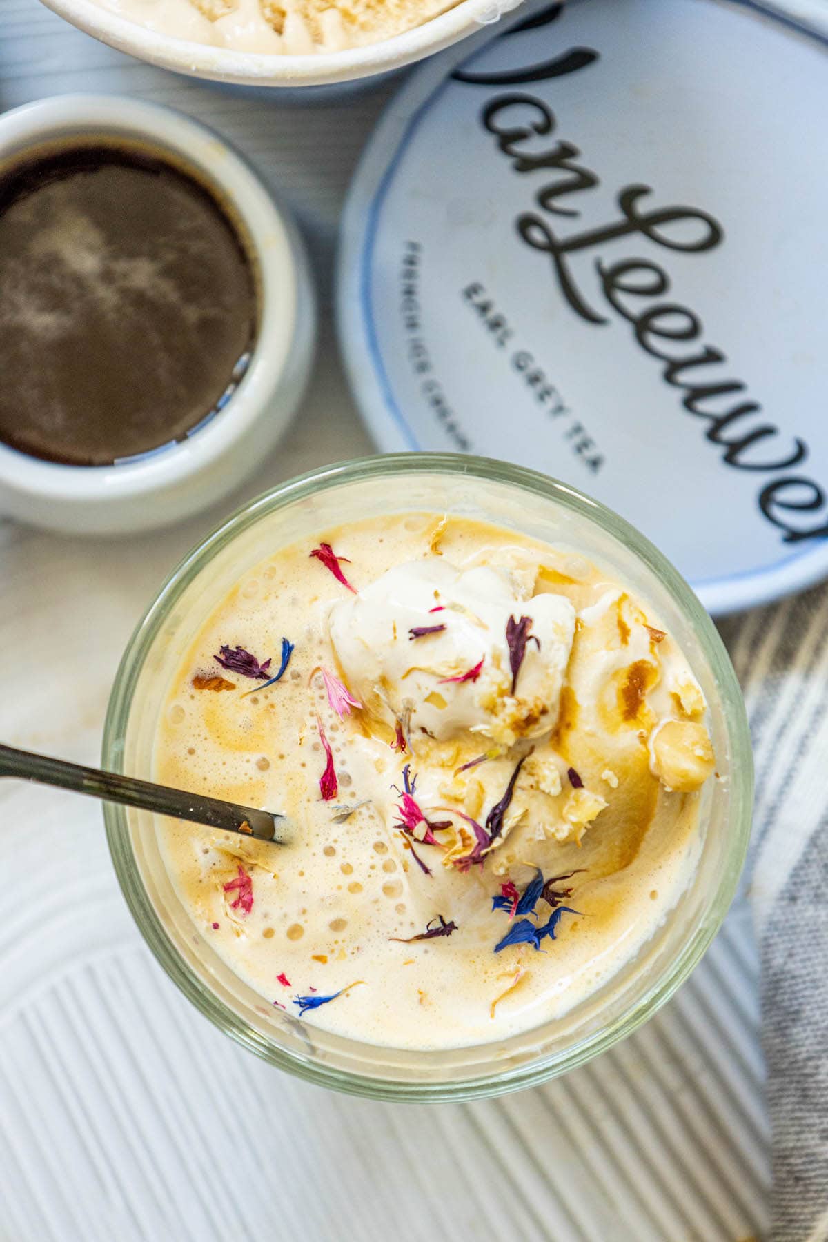 picture of earl grey affogato in a glass mug with corn flowers on top