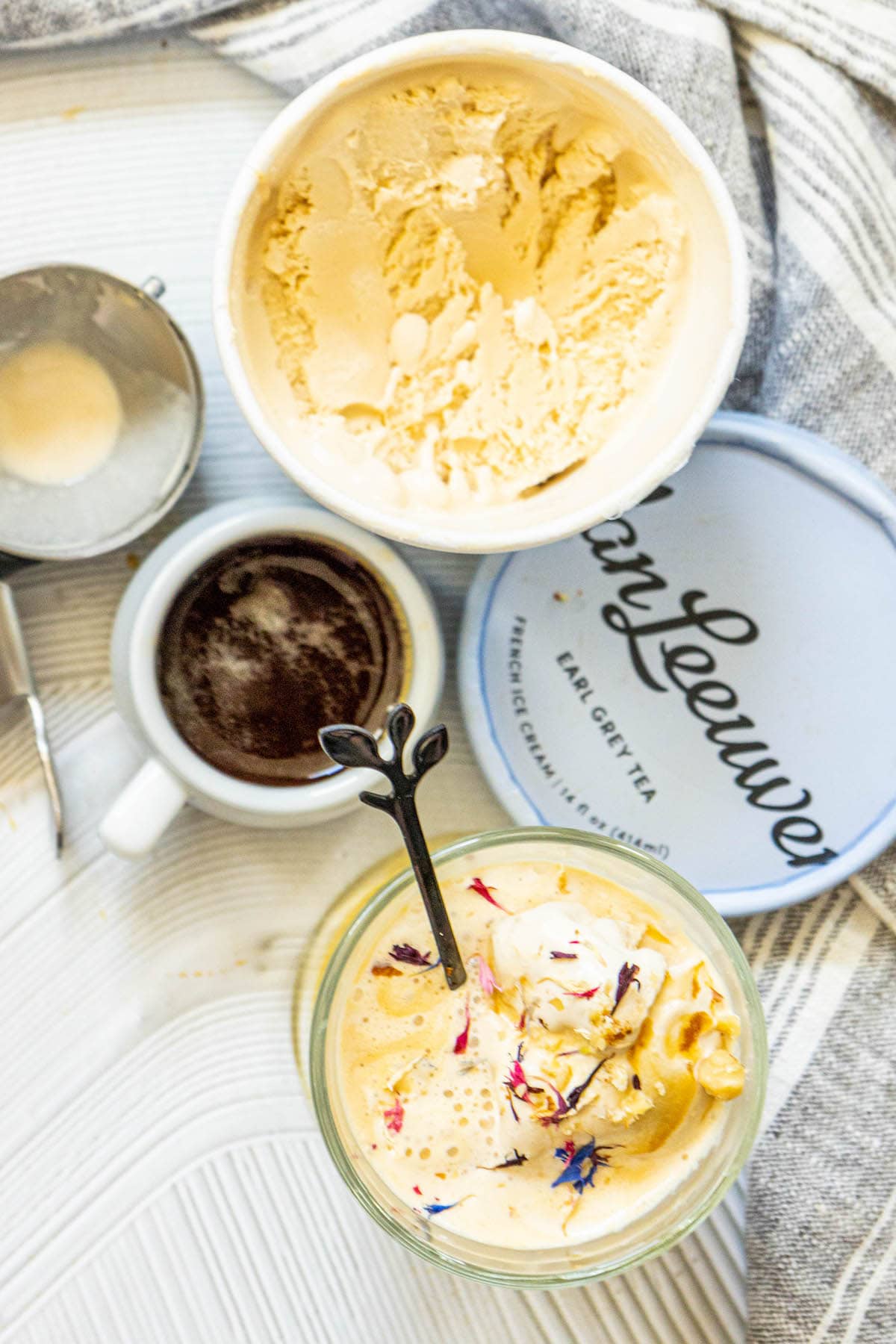 picture of earl grey affogato in a glass mug with corn flowers on top