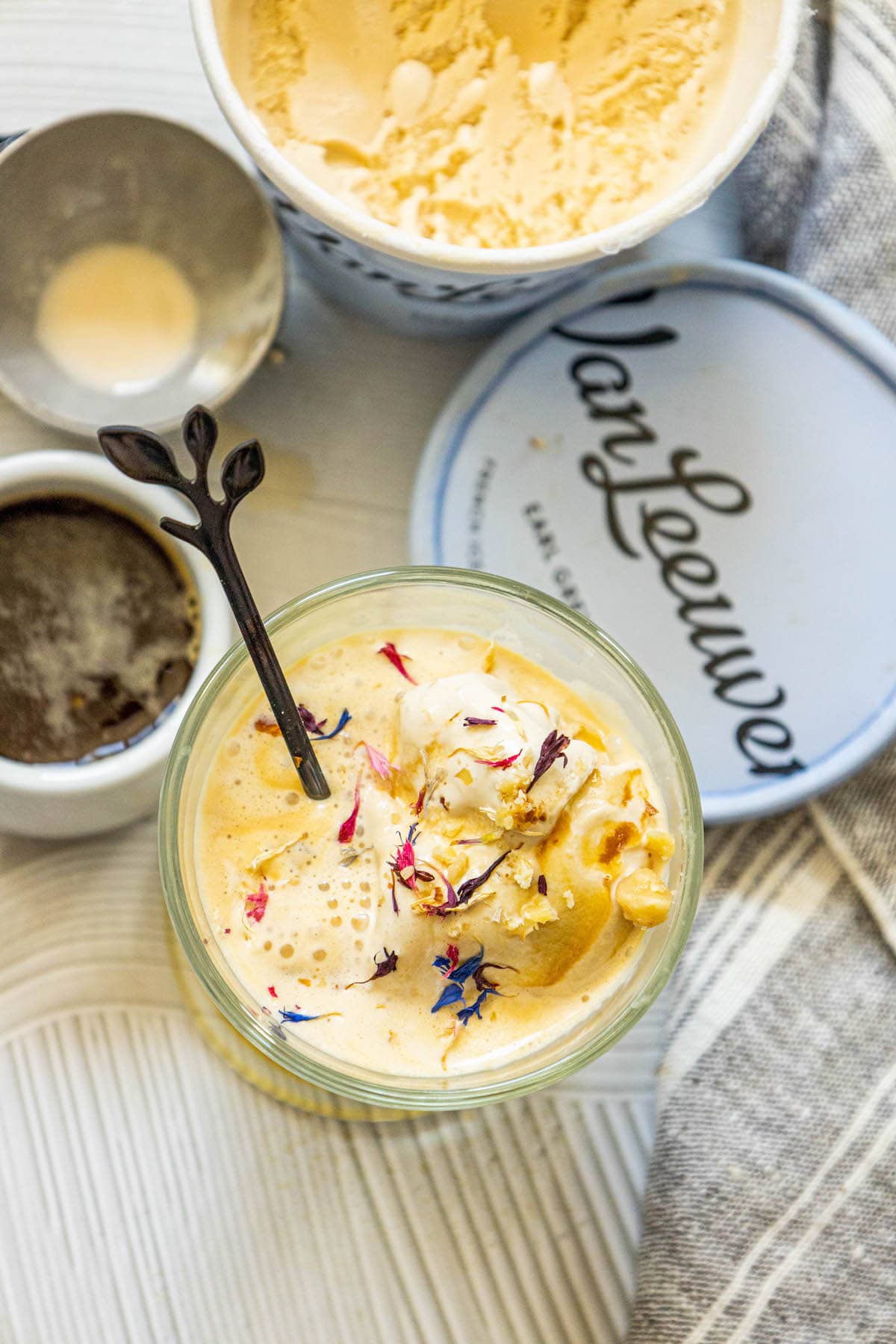 picture of earl grey affogato in a glass mug with corn flowers on top