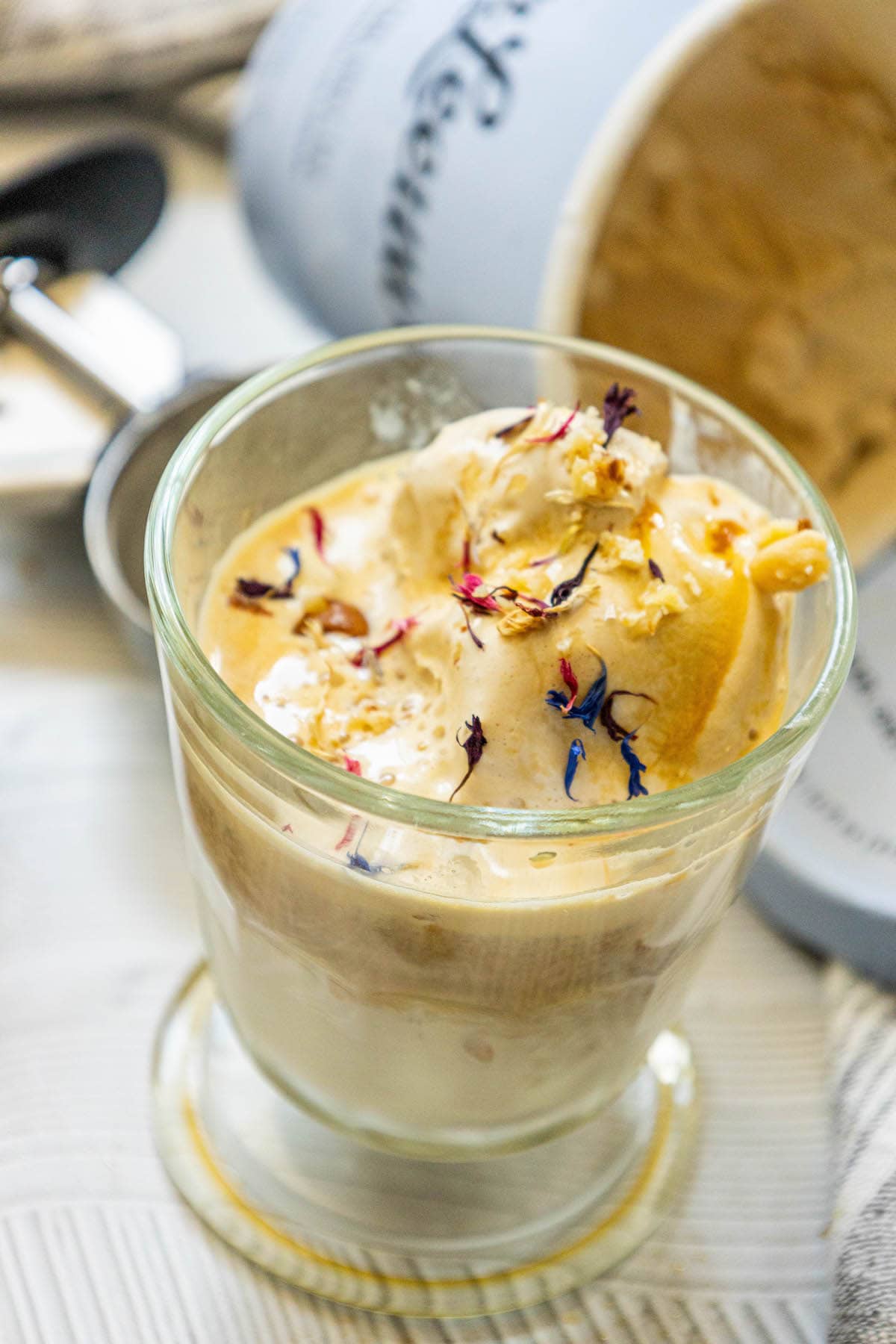 picture of earl grey affogato in a glass mug with corn flowers on top