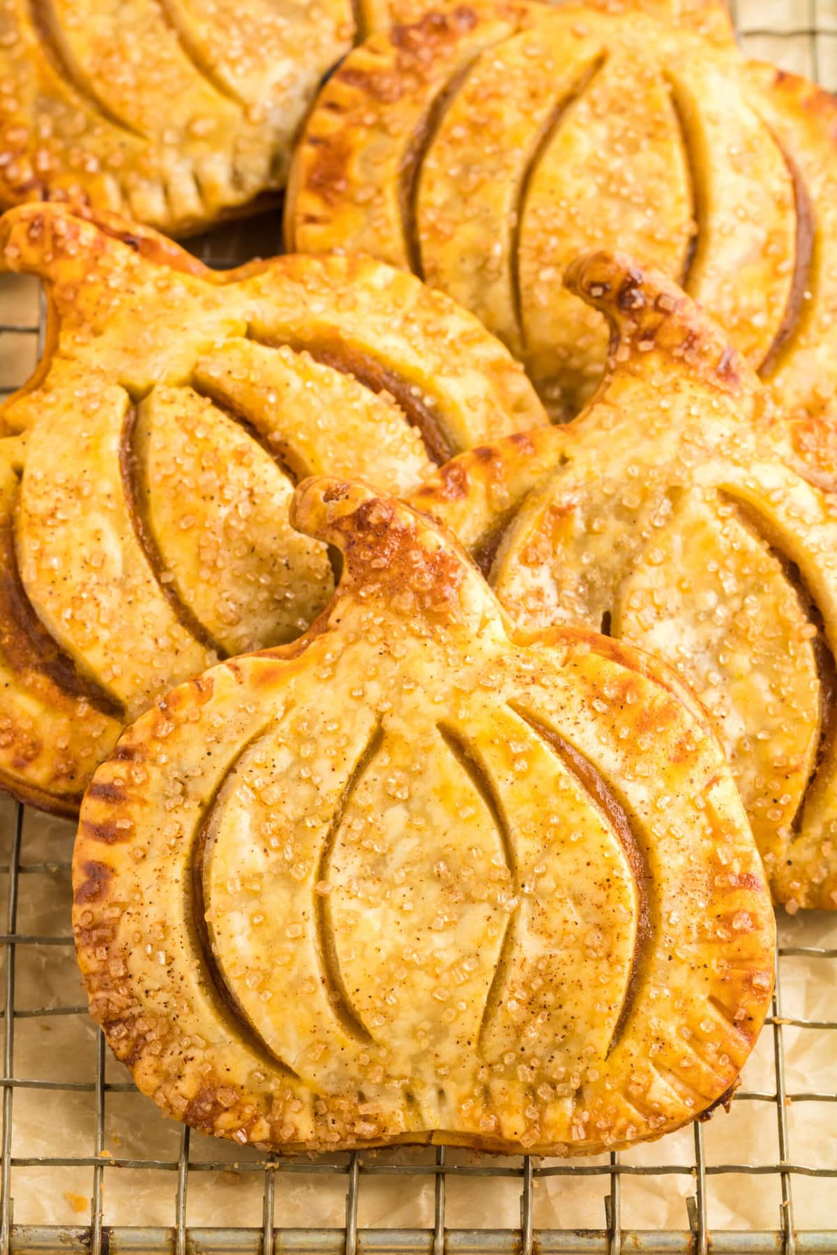 picture of pumpkin shaped hand pies on a cooling rack