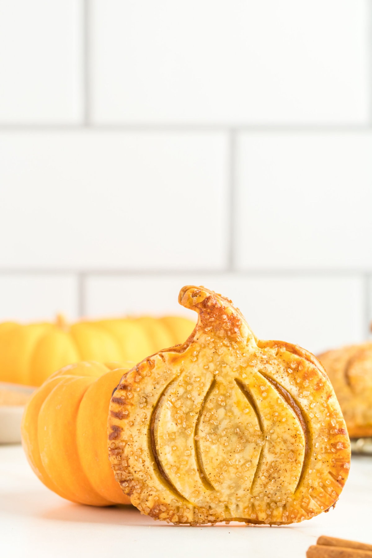 picture of pumpkin shaped hand pies on a table