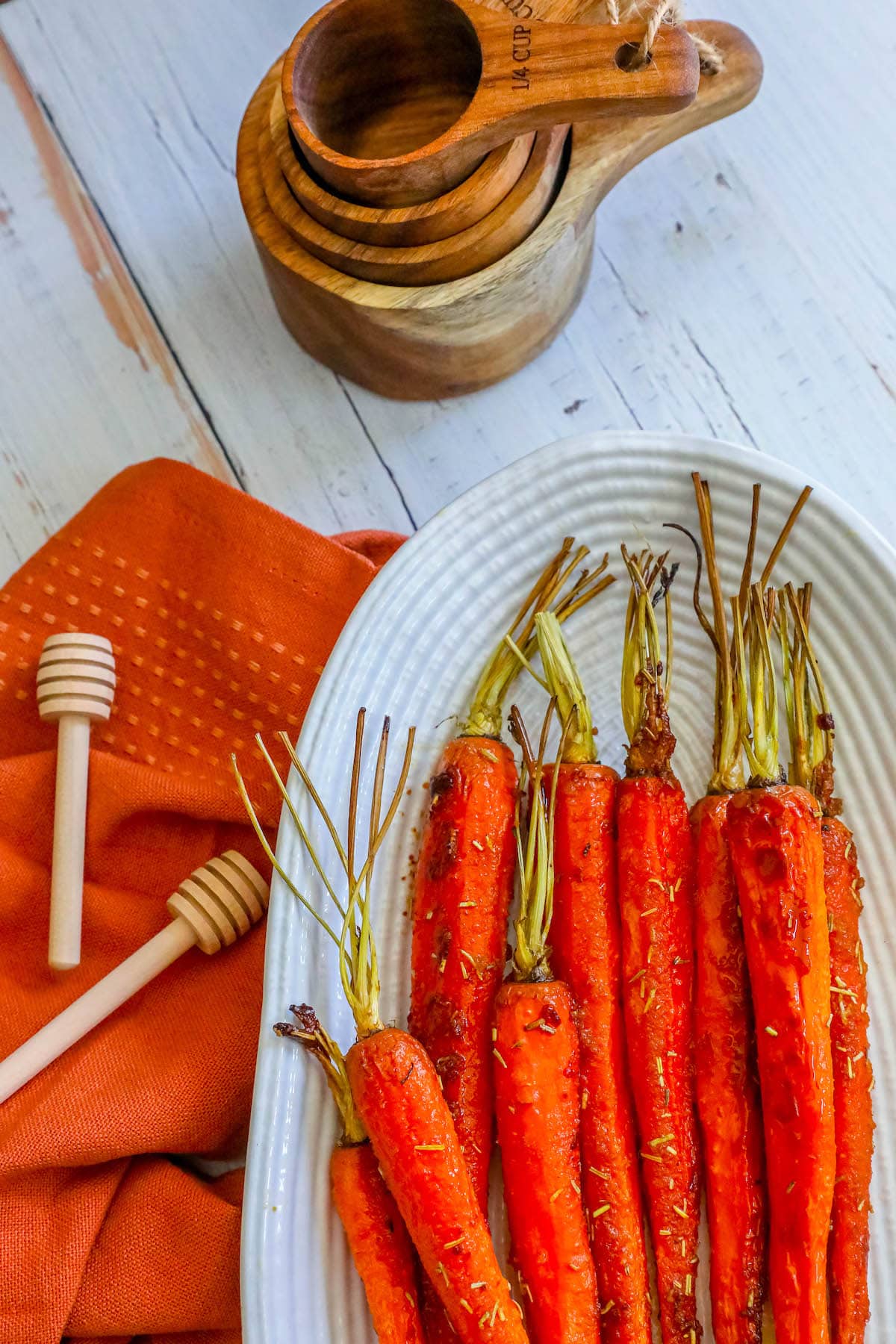 picture of honey garlic carrots on a plate with herbs