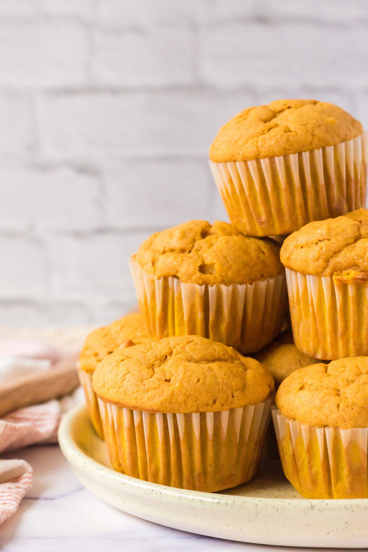 picture of pumpkin spice muffins stacked on a table