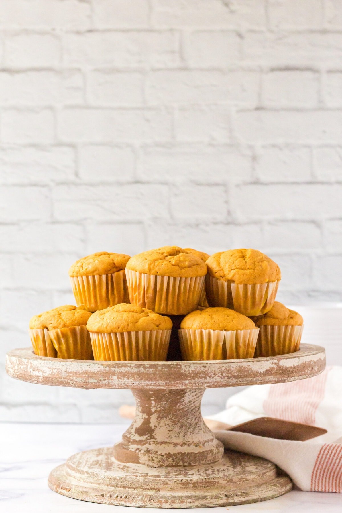 picture of pumpkin spice muffins stacked on a table