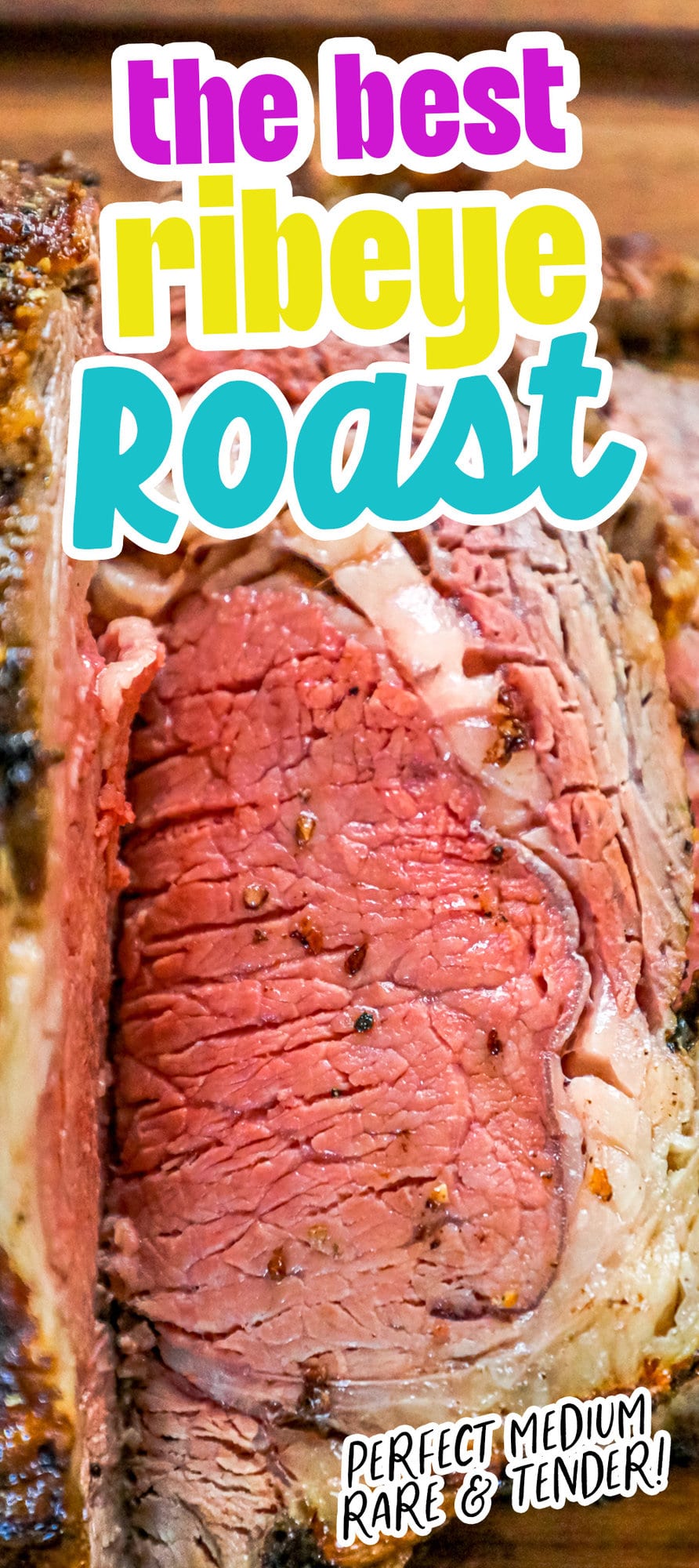 ribeye roast on a wood cutting board next to bowl of horseradish 