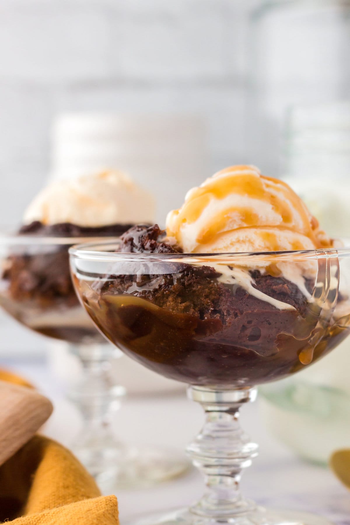 picture of caramel lava cake in a dish with a scoop of ice cream 