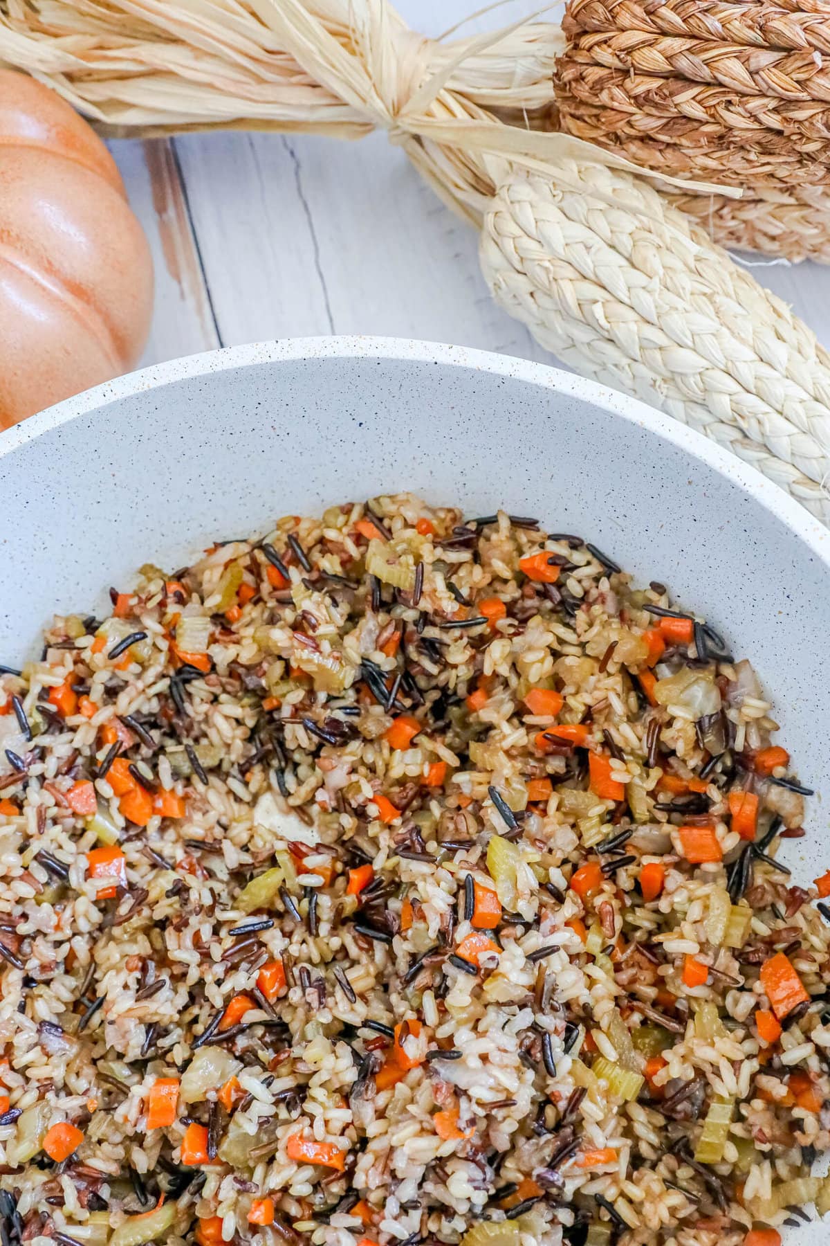 picture of wild rice pilaf in a white pan on a table 
