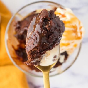 picture of caramel lava cake on a spoon with ice cream