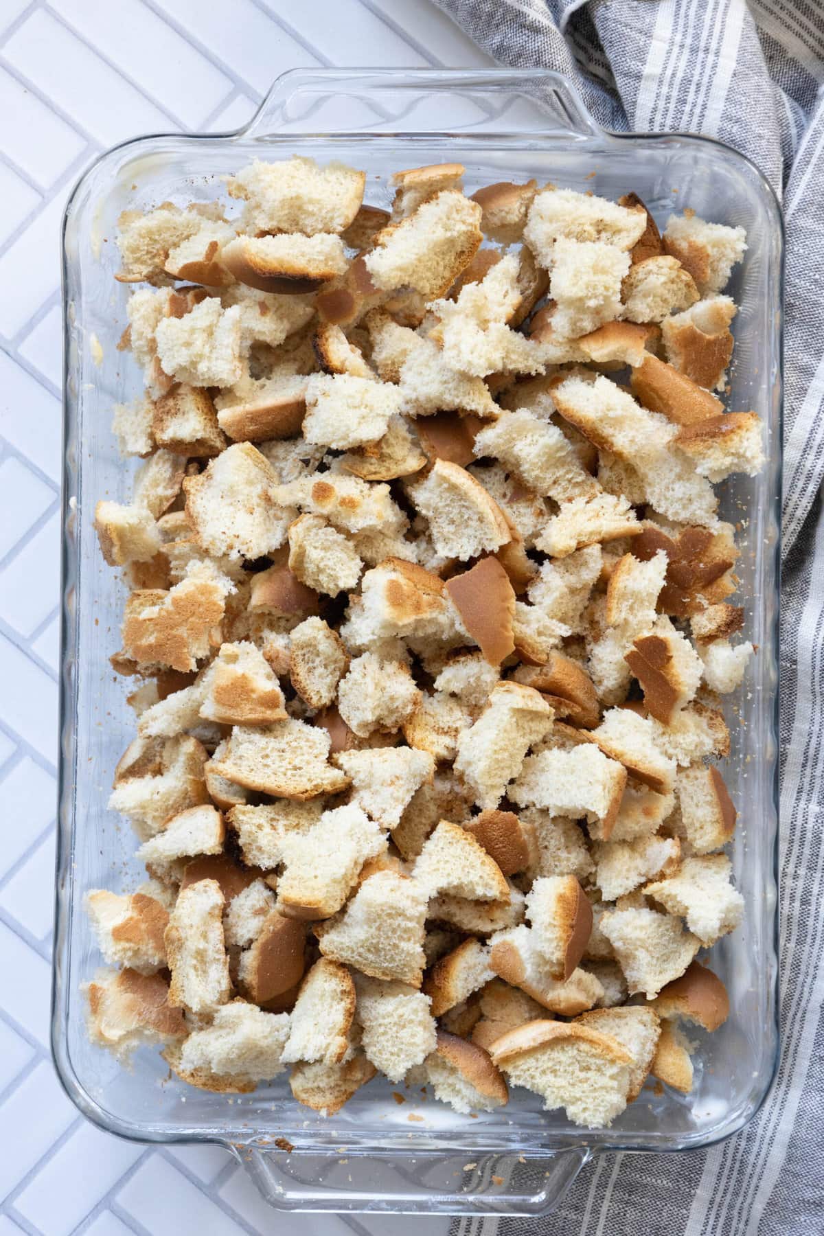 A glass baking dish with cheeseburger stuffing.