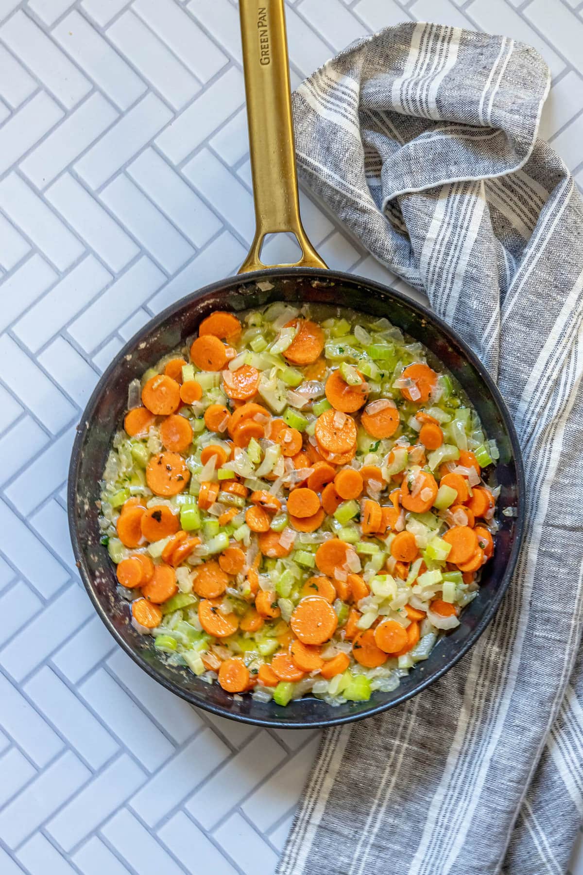 A frying pan filled with carrots and rice, making for an easy vegetarian stuffing option.