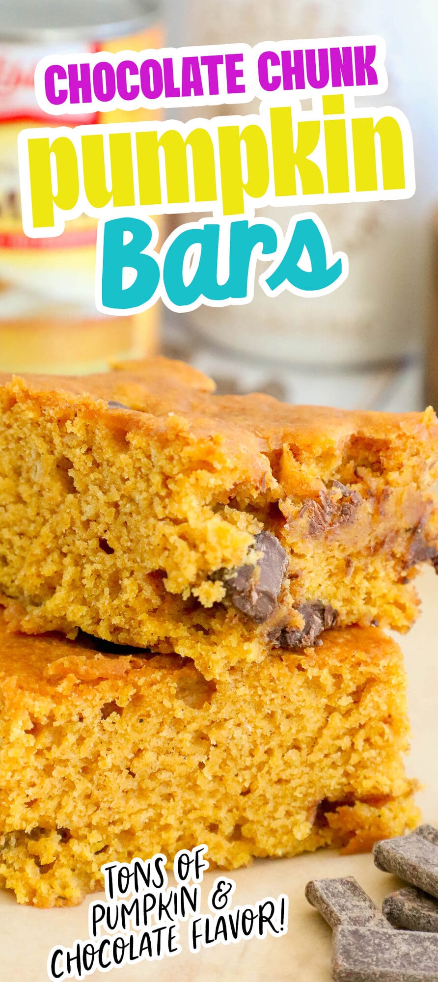 picture of baked pumpkin bars with chocolate chunks stacked on top of each other on a table