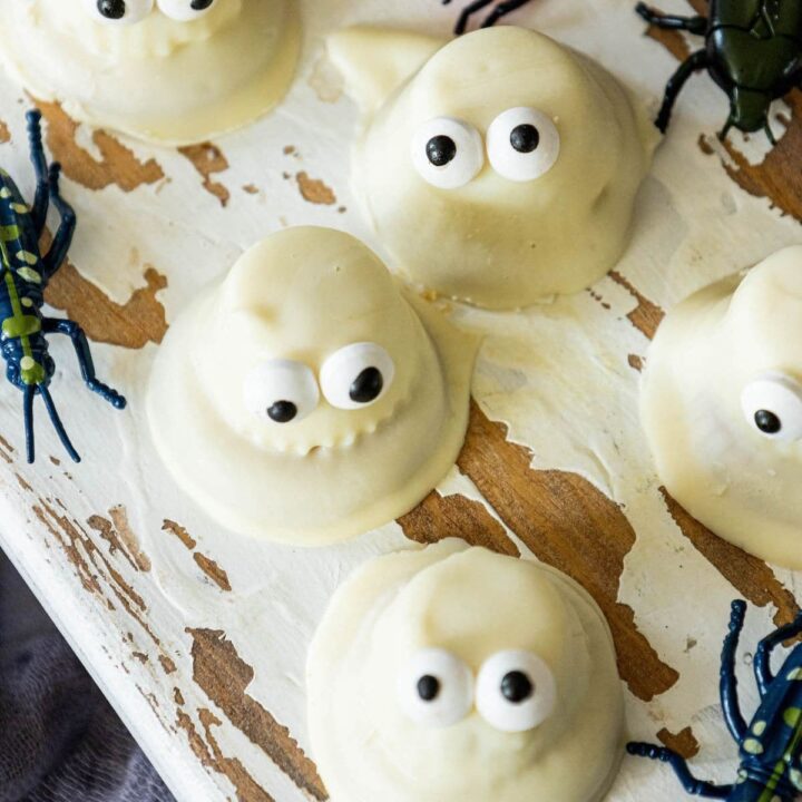 cookies dipped in white chocolate with candy eyes to look like ghosts