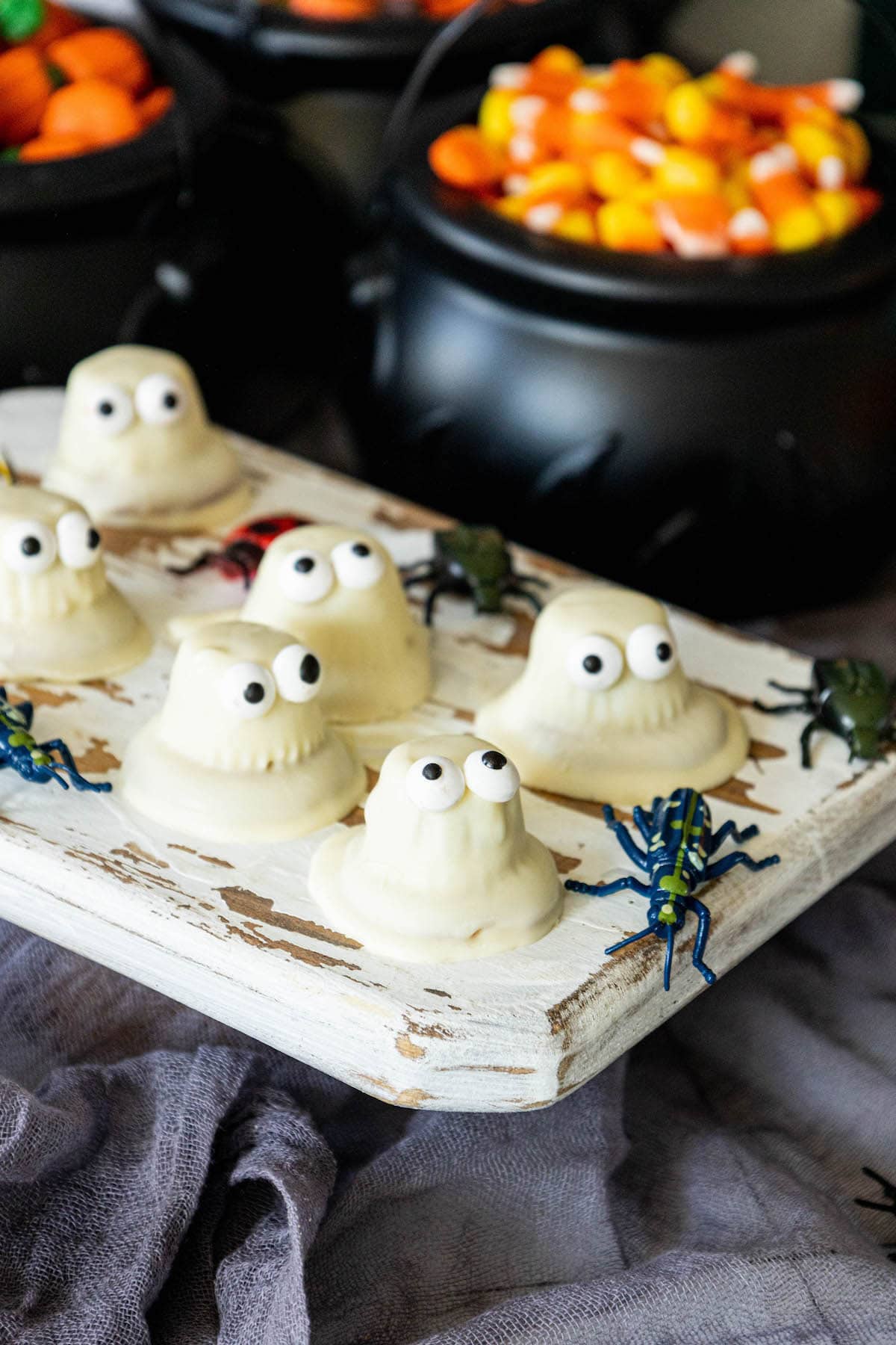 cookies dipped in white chocolate with candy eyes to look like ghosts