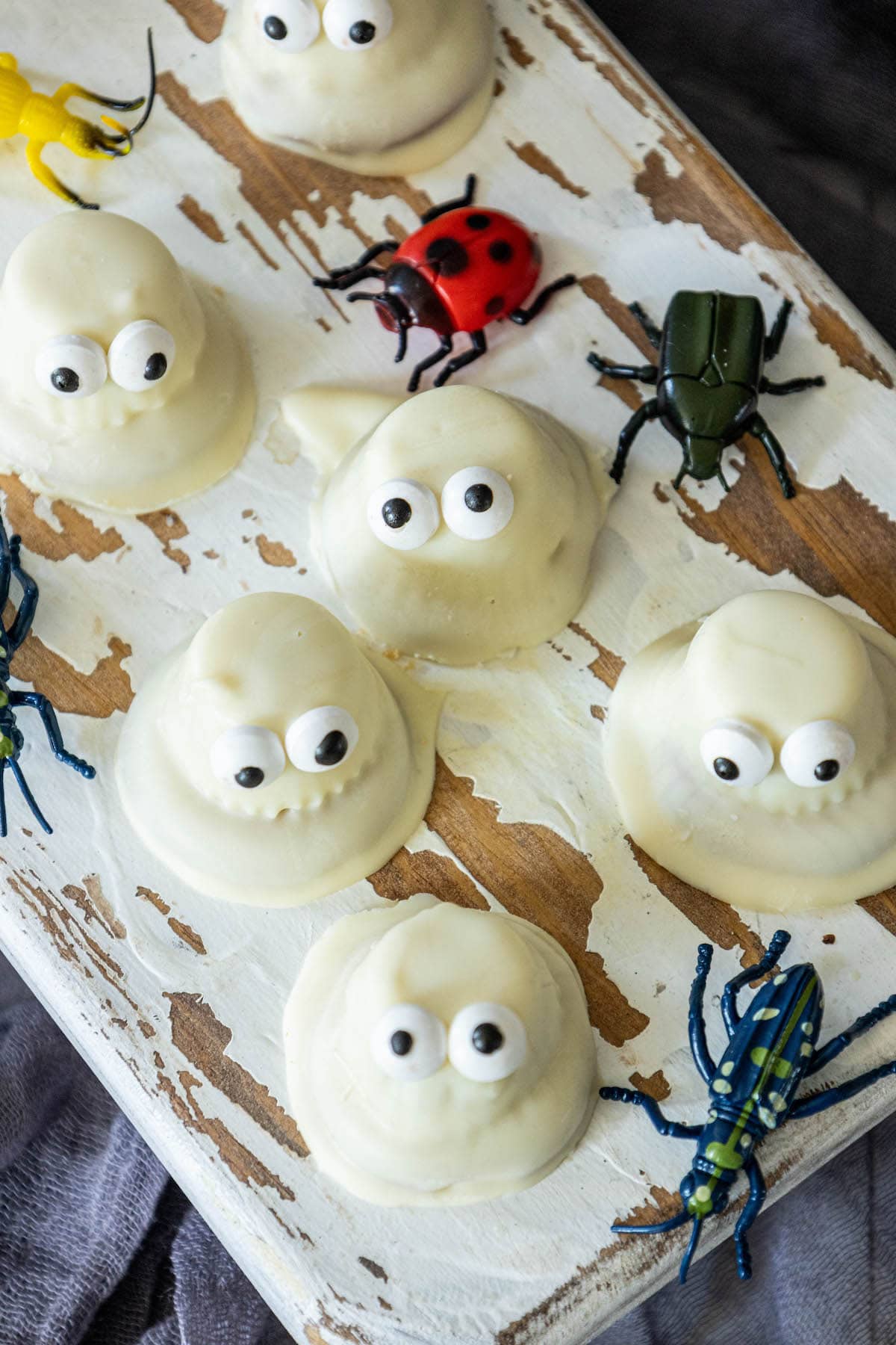 cookies dipped in white chocolate with candy eyes to look like ghosts