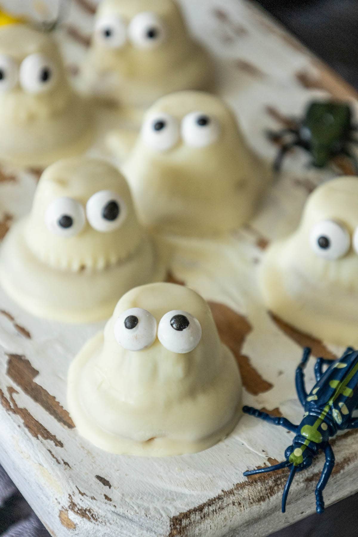 cookies dipped in white chocolate with candy eyes to look like ghosts