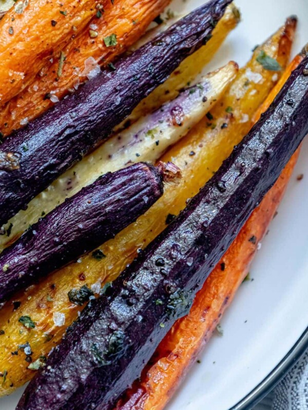 grilled carrots in a white bowl