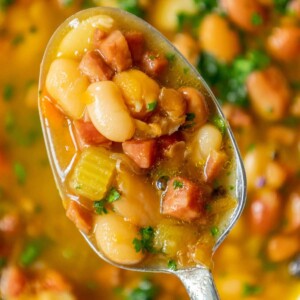 picture of diced ham and bean soup on a spoon