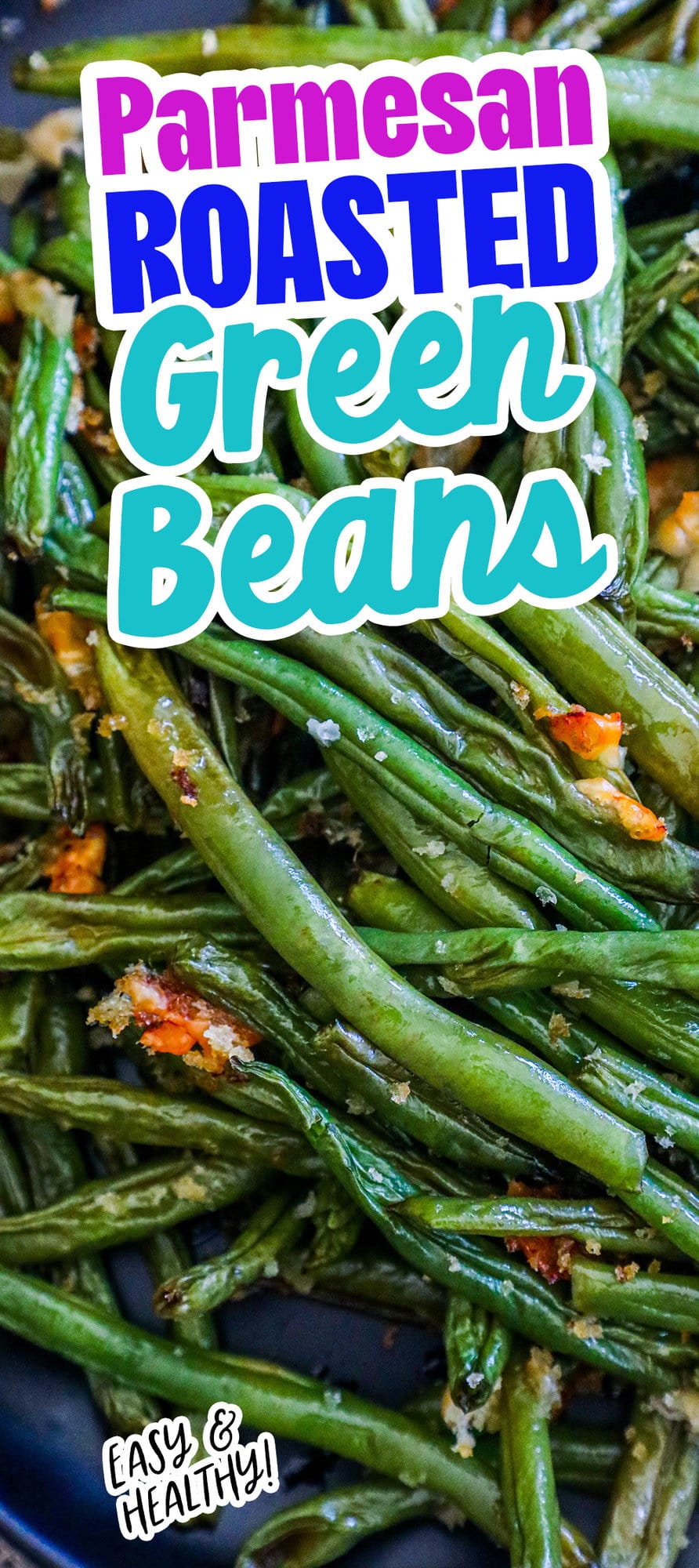 picture of parmesan roasted green beans on a black plate on a table