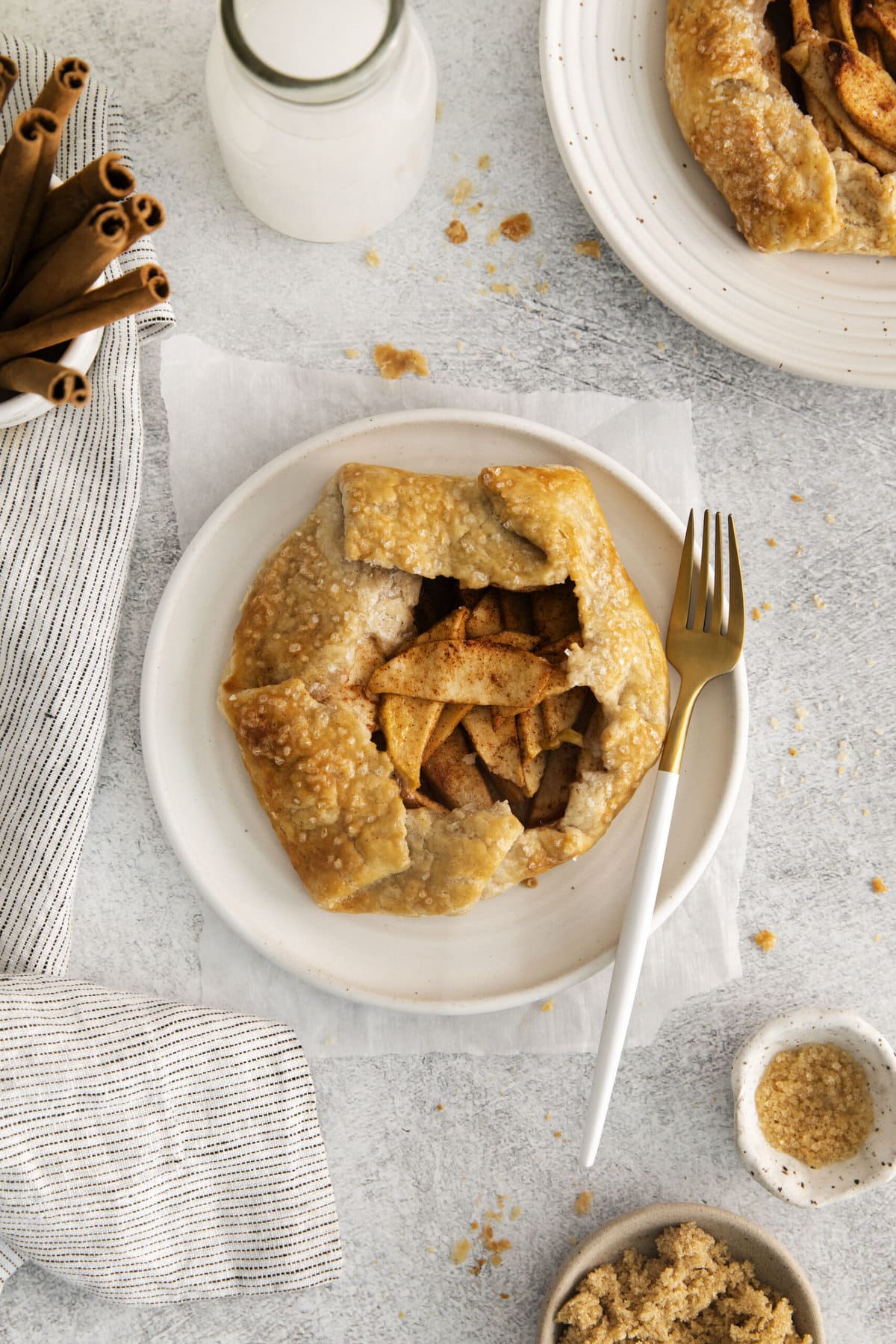 picture of apple galette on a table with a fork on the plate