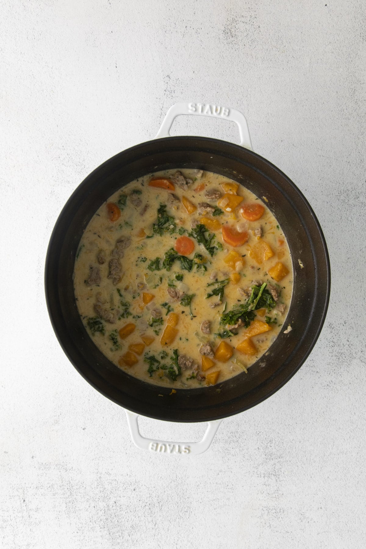 creamy turkey chili with sweet potatoes and vegetables in a large stock pot