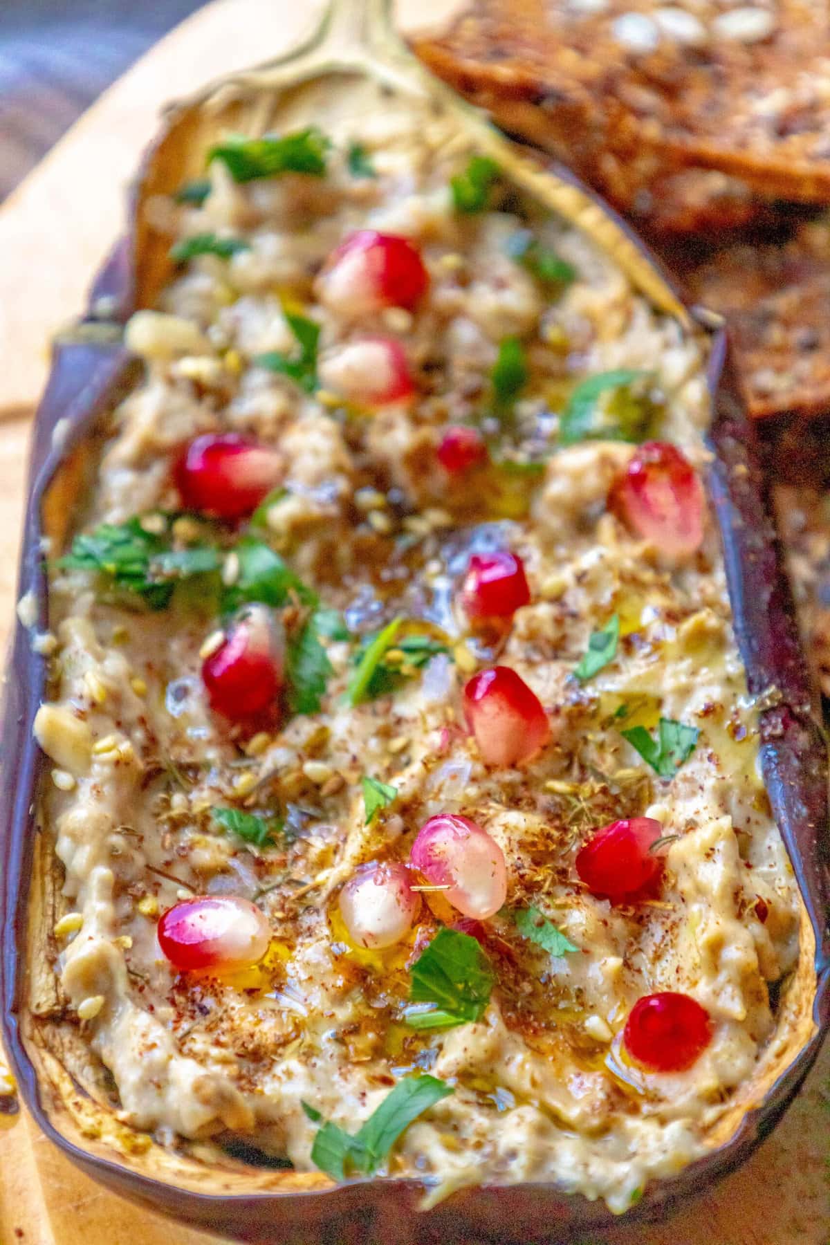 picture of roasted eggplant with tahini and pomegranates and cilantro