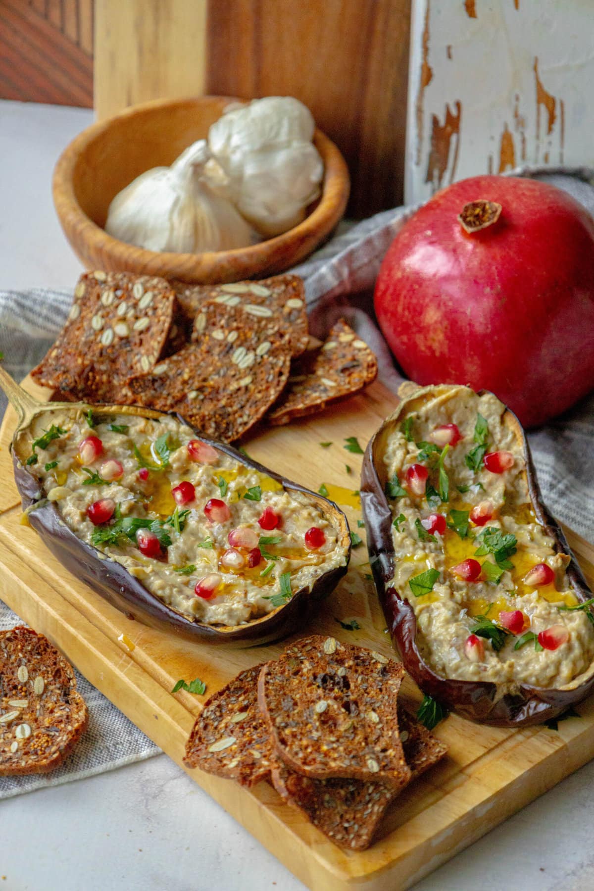 picture of roasted eggplant with tahini and pomegranates and cilantro