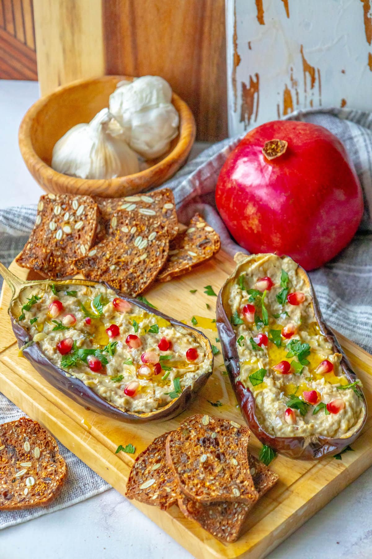 picture of roasted eggplant with tahini and pomegranates and cilantro