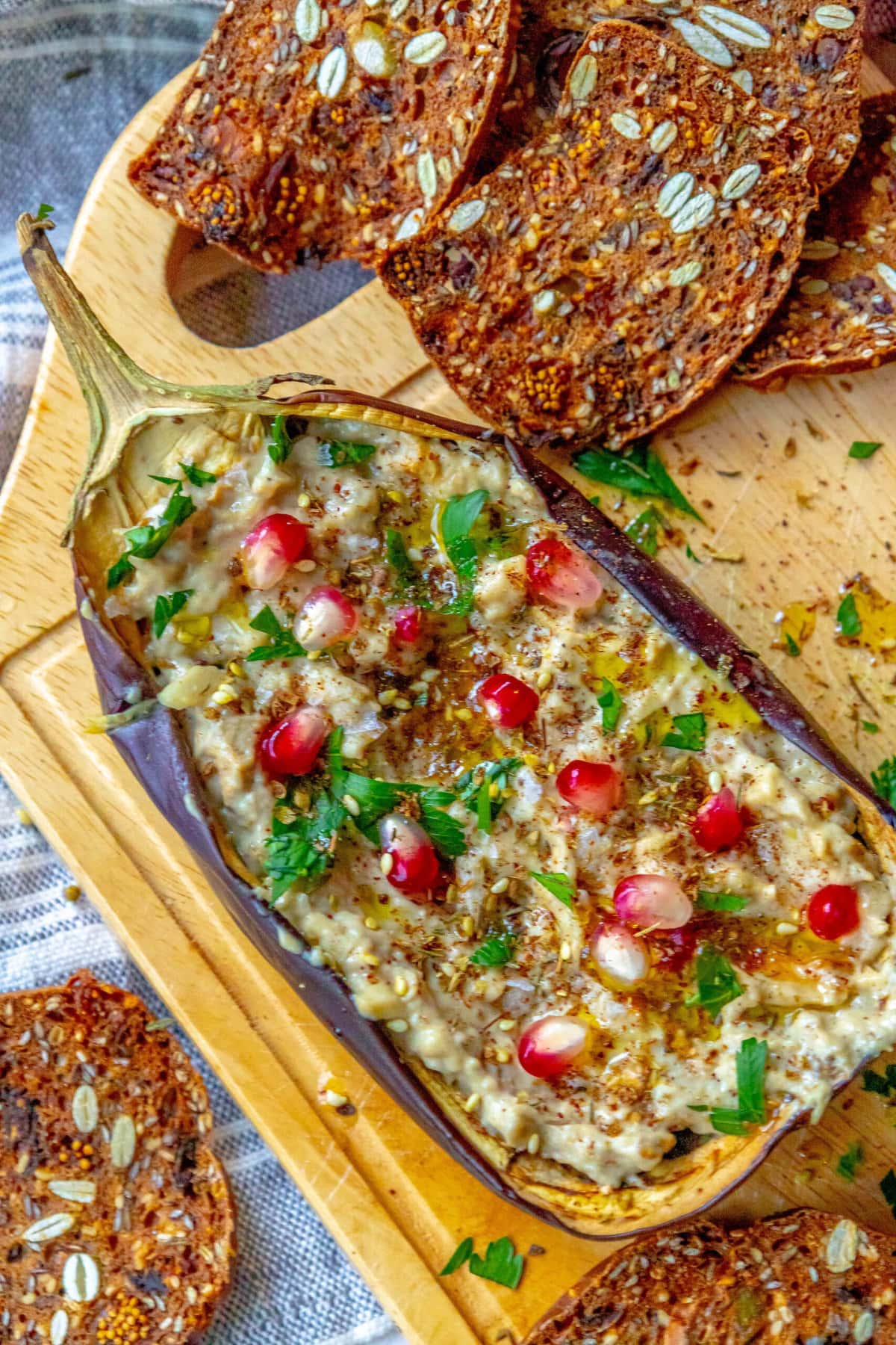 picture of roasted eggplant with tahini and pomegranates and cilantro