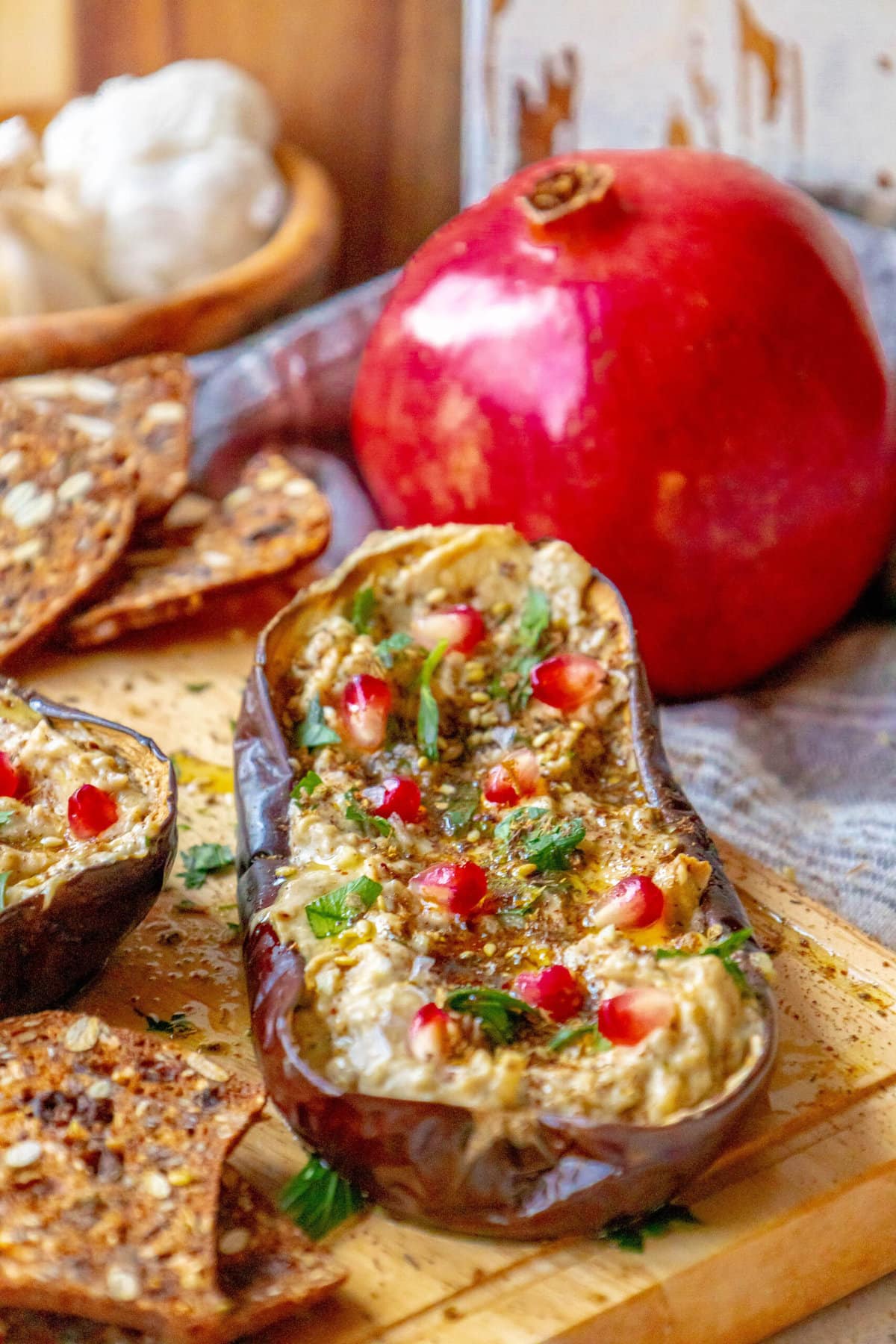 picture of roasted eggplant with tahini and pomegranates and cilantro