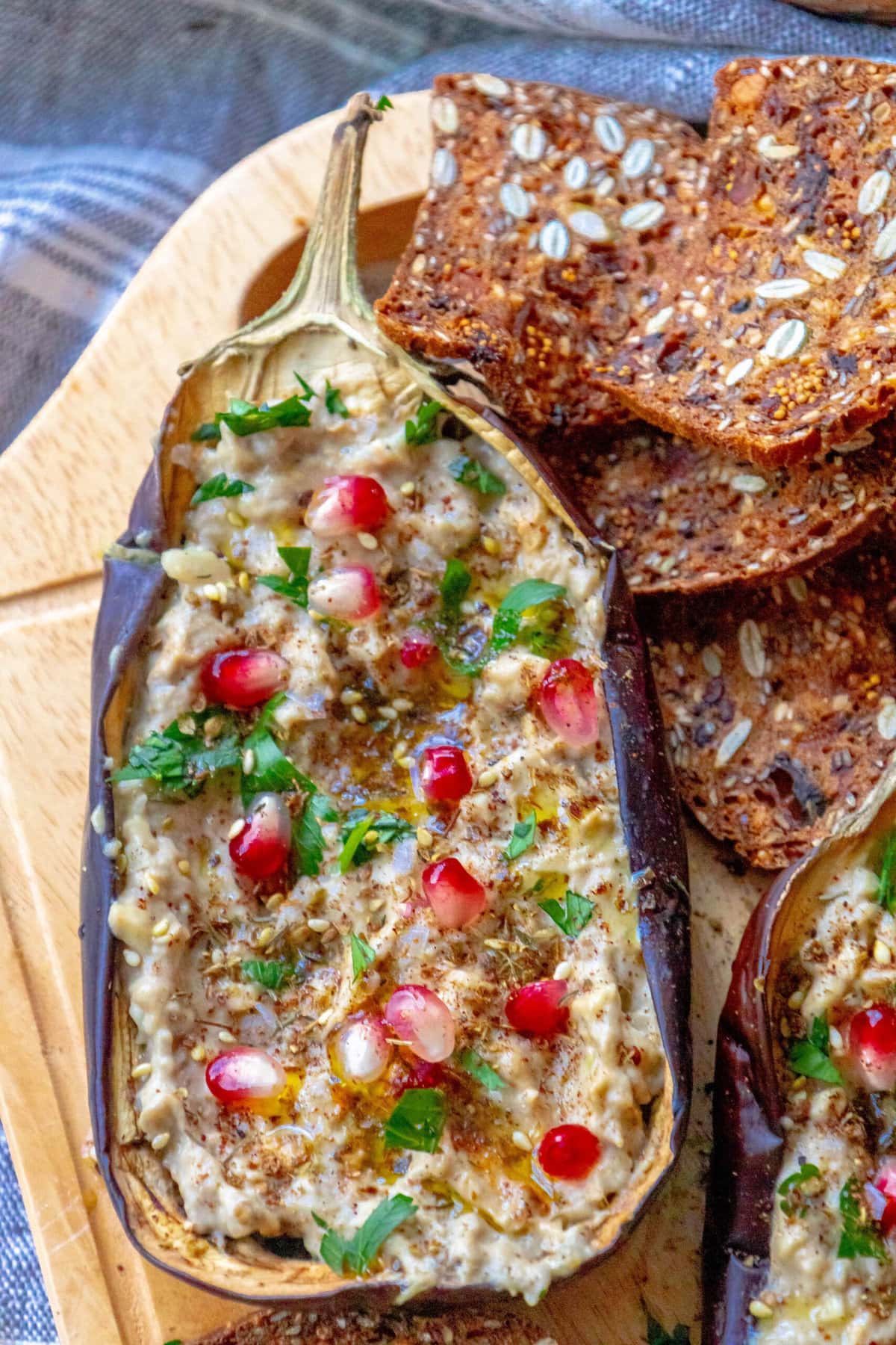 picture of roasted eggplant with tahini and pomegranates and cilantro