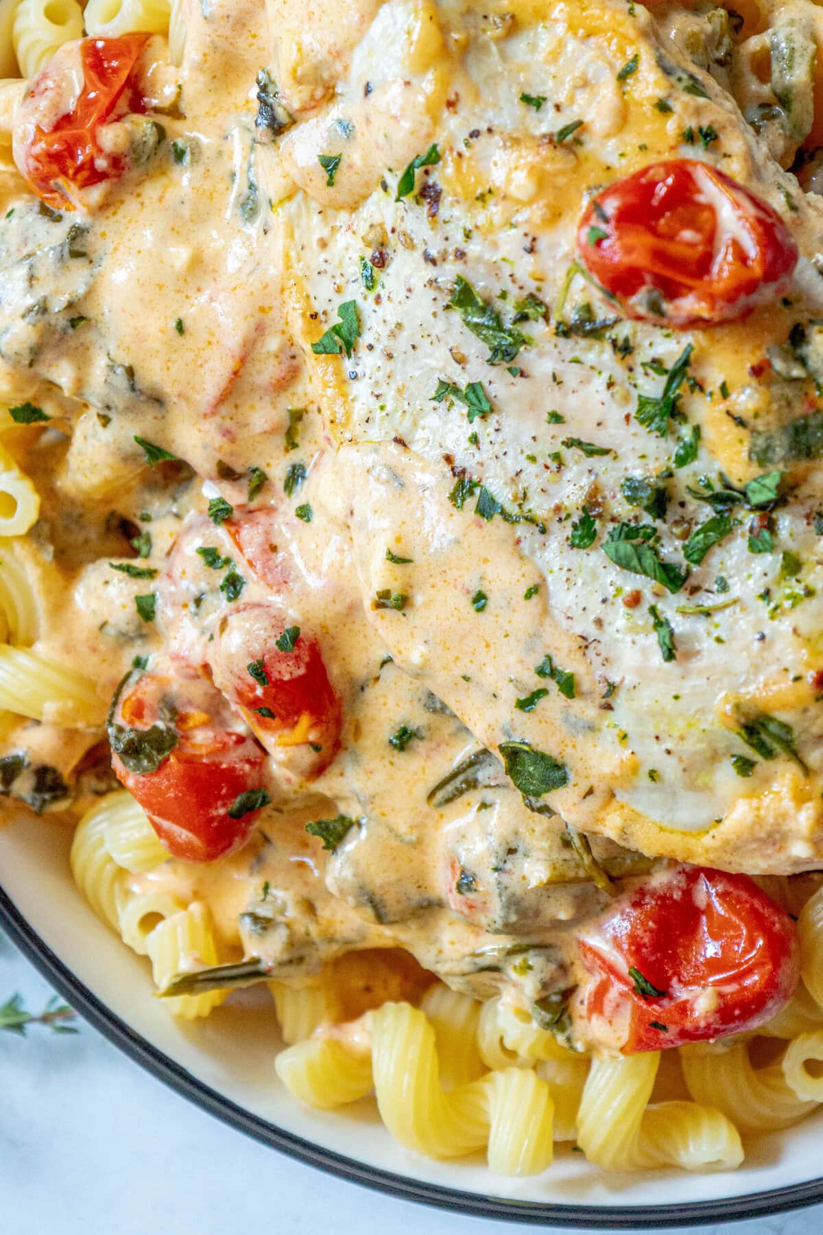 baked feta spinach and chicken up close on noodles