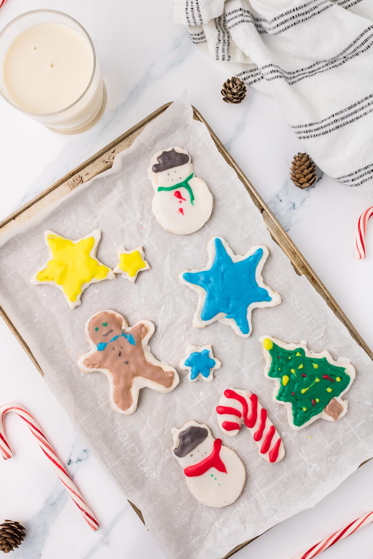 picture of iced christmas cookies on a white plate on a table