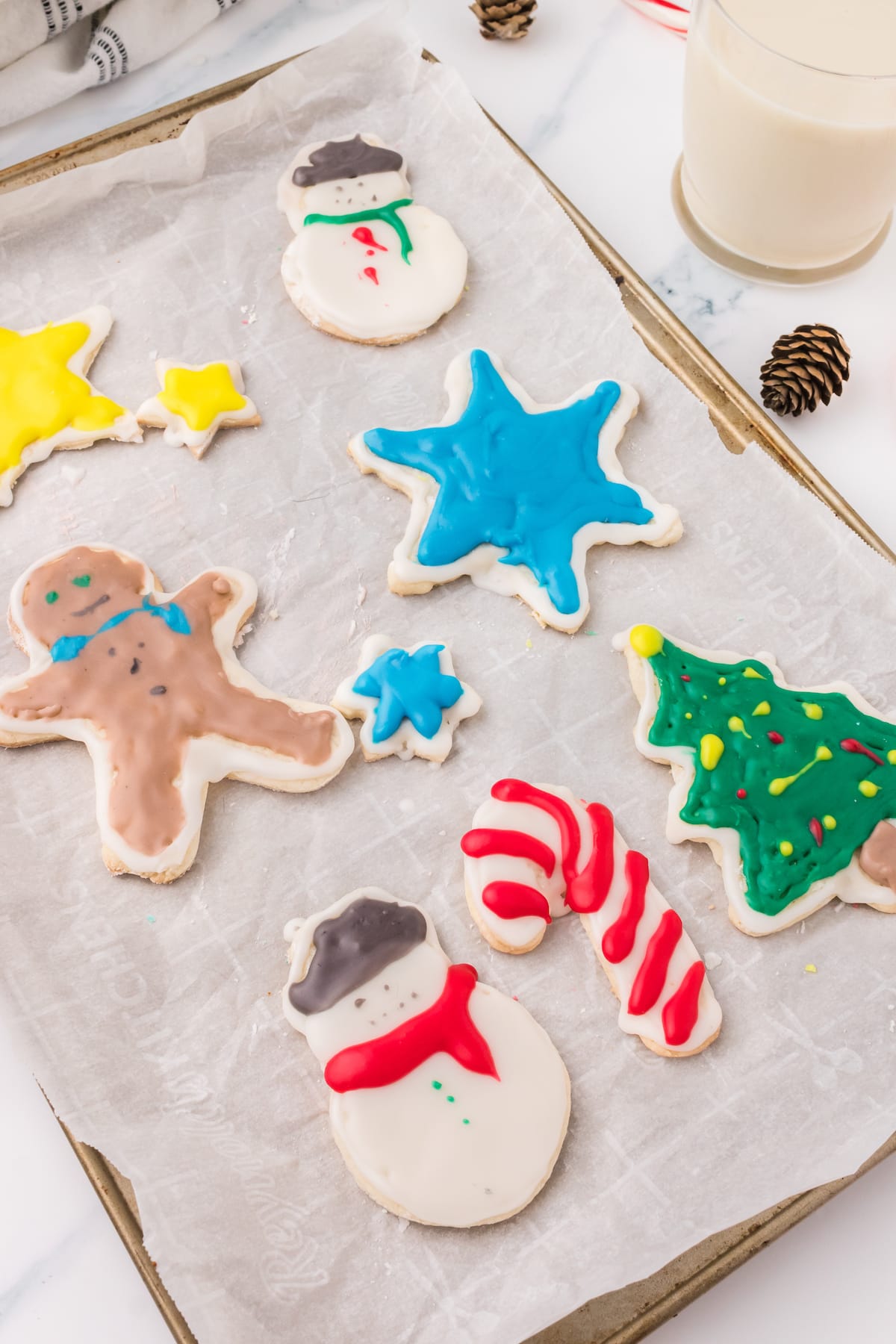 picture of iced christmas cookies on a white plate on a table