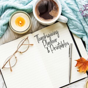 picture of notebook and glasses with coffee and leaves on a table