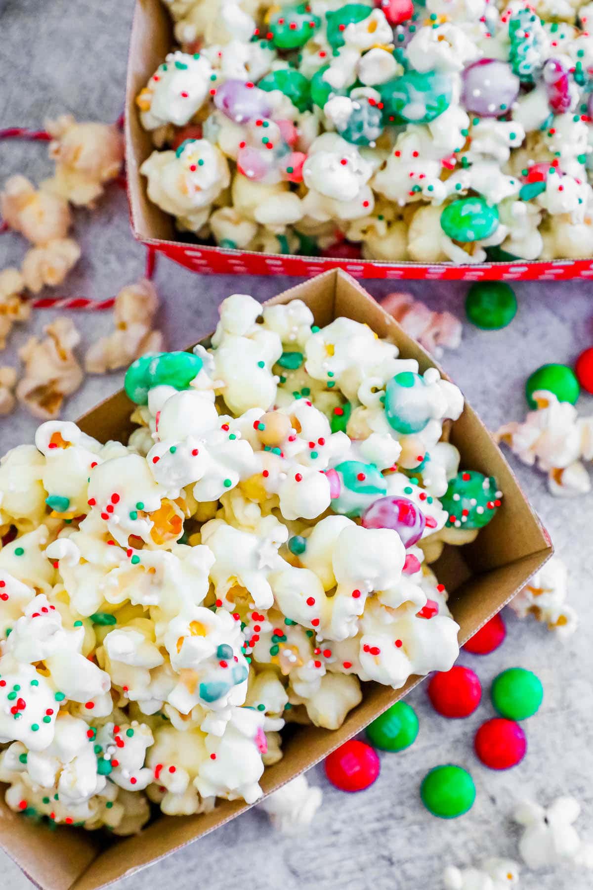 popcorn covered in white chocolate white sprinkles and candies up close