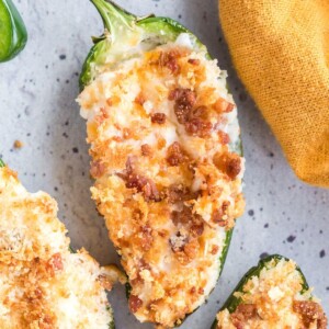 air fried jalapeño filled with cream cheese and breadcrumbs on a plate