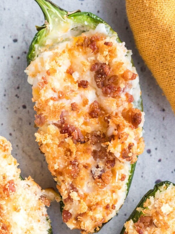 air fried jalapeño filled with cream cheese and breadcrumbs on a plate