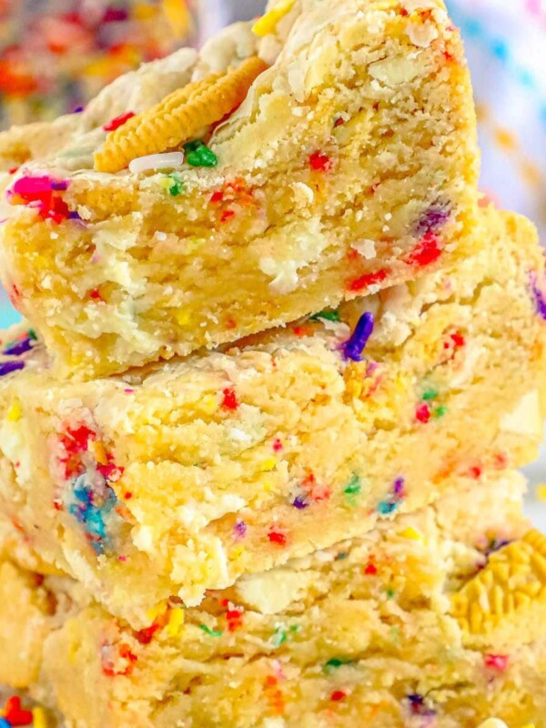 funfetti cookie bars stacked on top of each other on a table