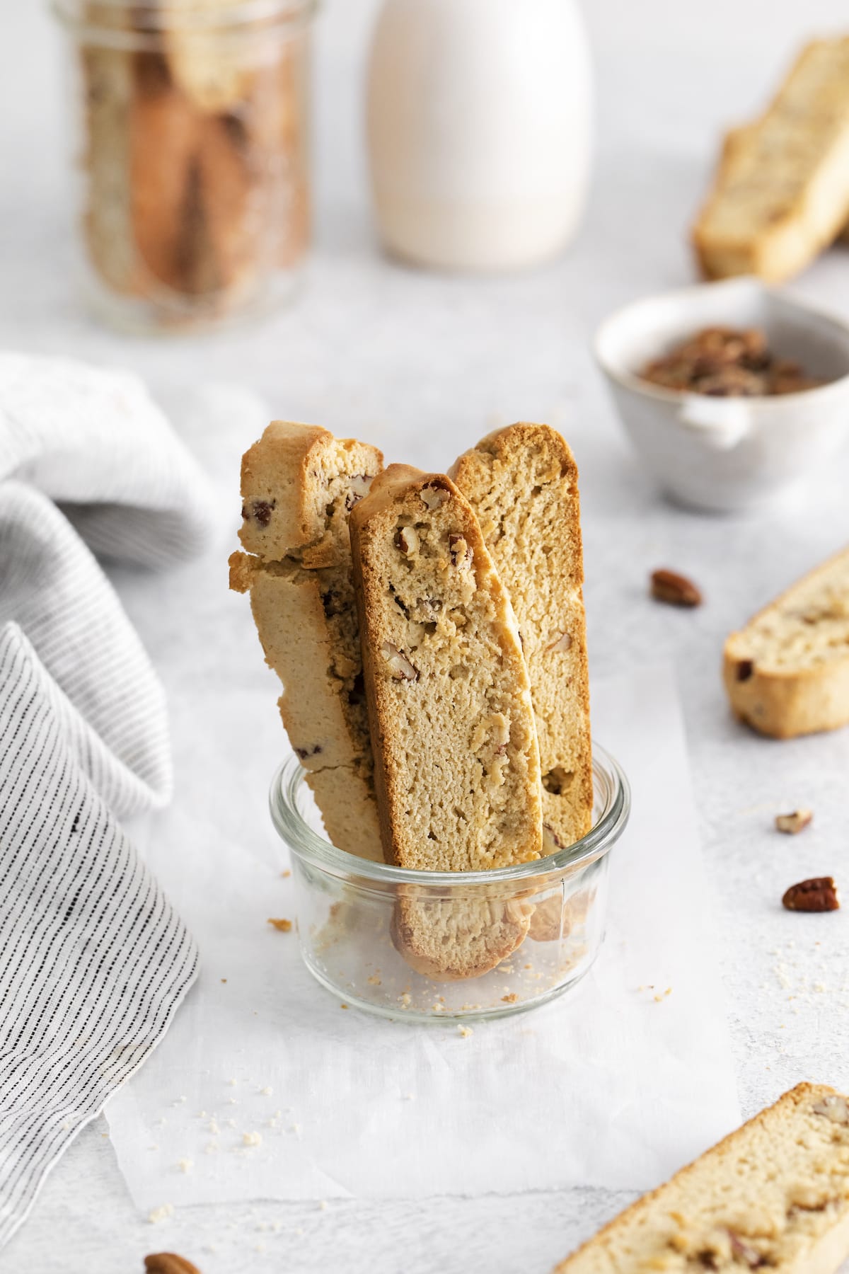 baked biscotti with pecan in a jar on a table