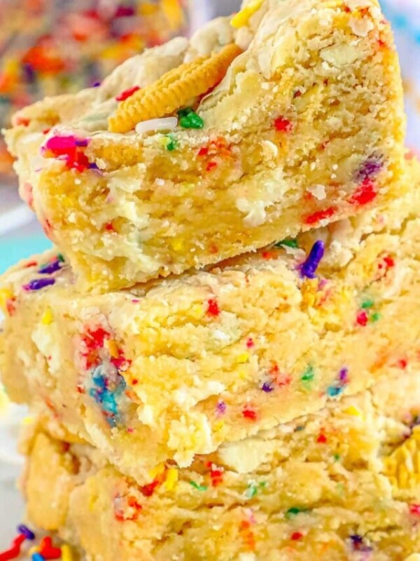 funfetti cookie bars stacked on top of each other on a table