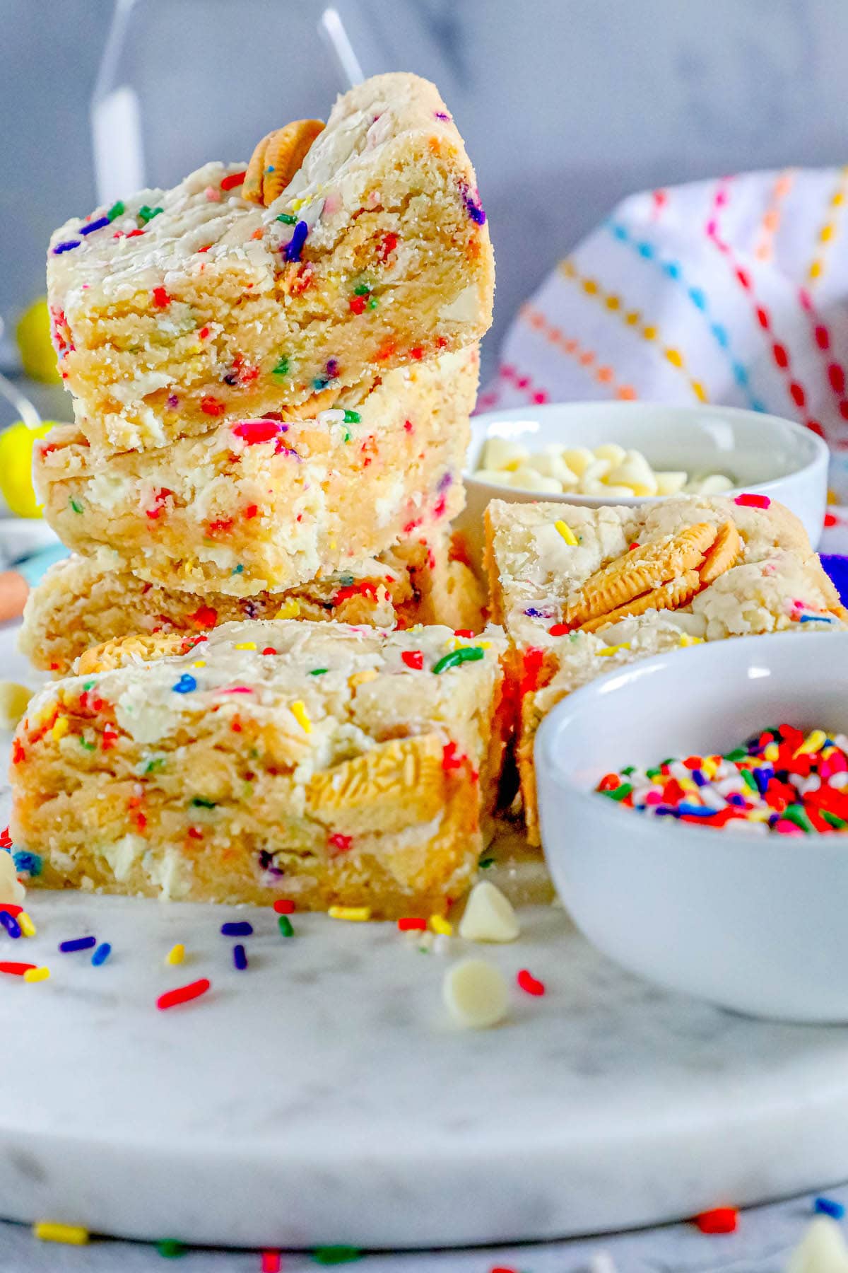 funfetti cookie bars stacked on top of each other on a table