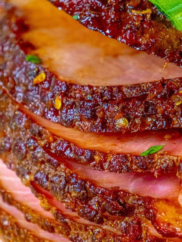 A close-up of a Sticky Honey Soy spiral ham on a plate.
