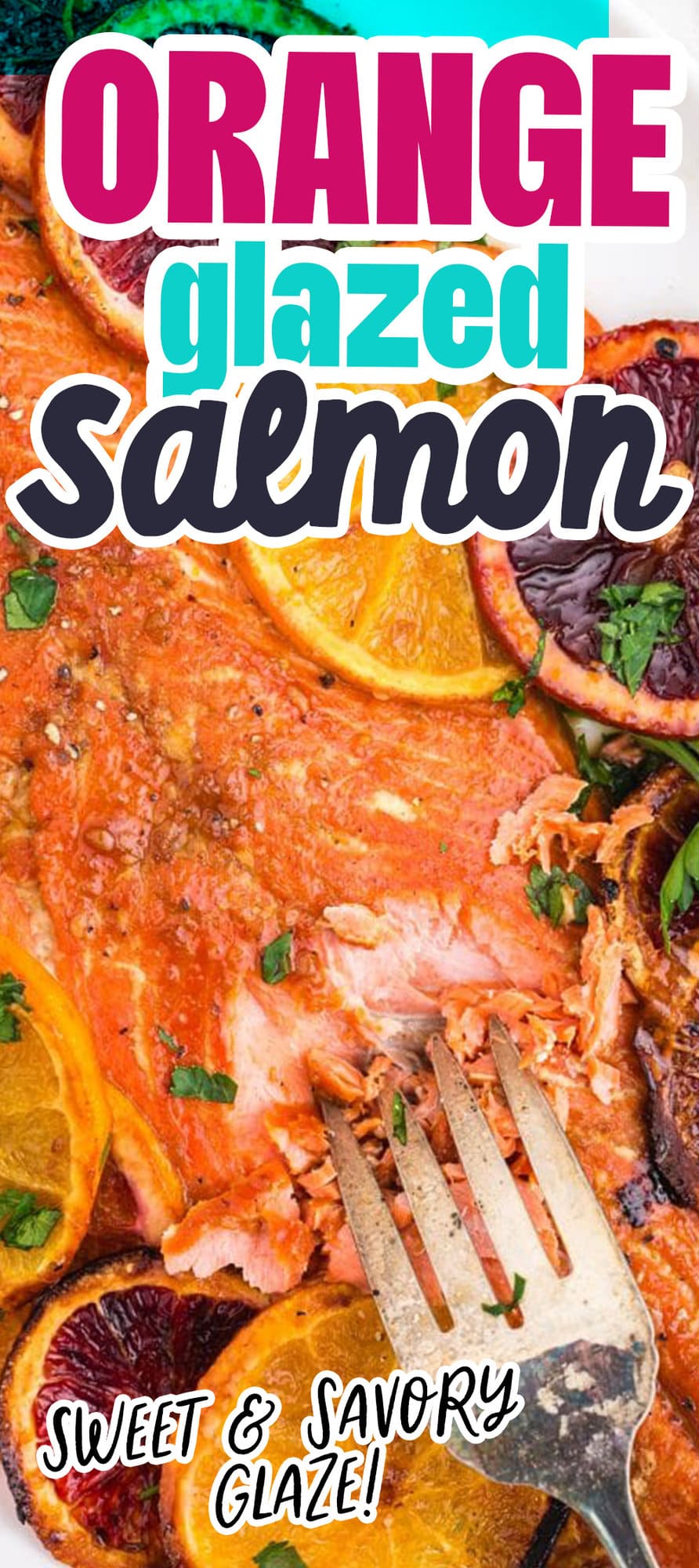 salmon with orange glaze on a white platter with browned oranges and chopped parsley on top on a table