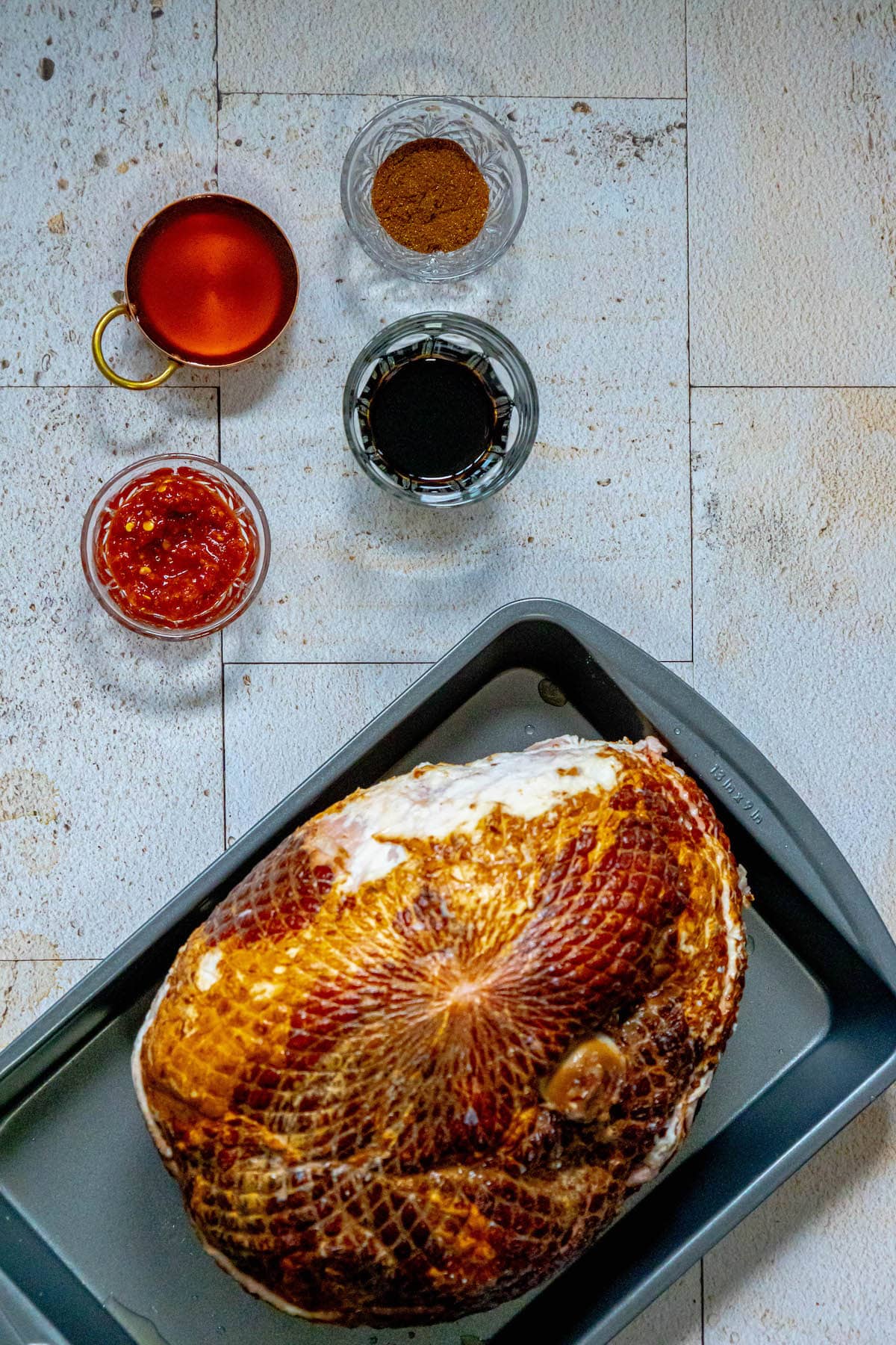 soy sauce, honey, sweet chili sauce, ham on a table