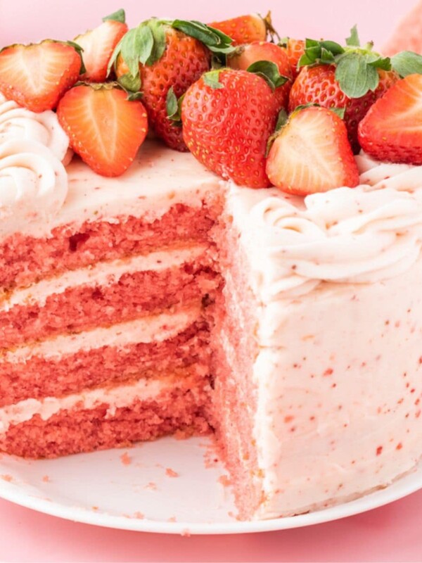 delicious pink cake topped with strawberries